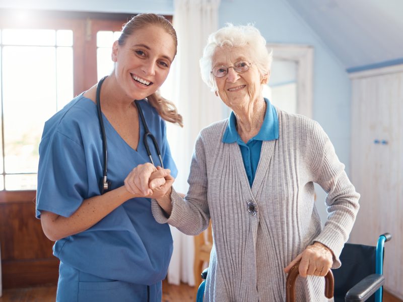 holding-hands-portrait-and-nurse-with-a-senior-woman-after-medical-consultation-in-a-nursing-facil.jpg